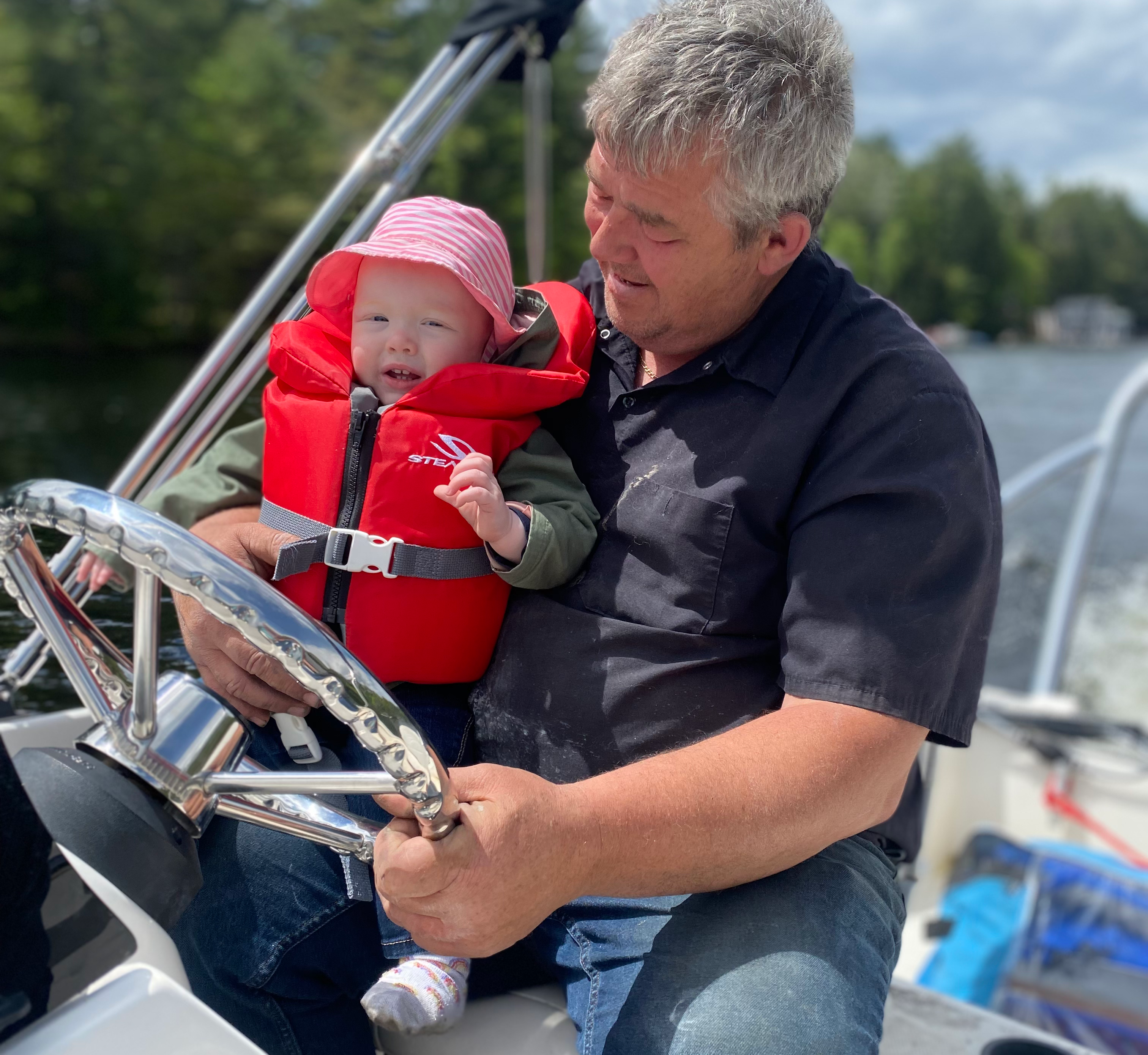 Family enjoying a boat ride on the water